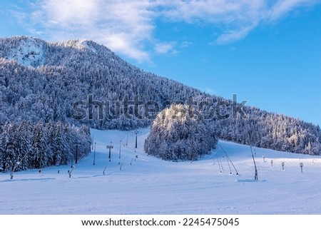 Winter landscape photo of completely empty ski slopes in Kranjska Gora ski resort, Slovenia