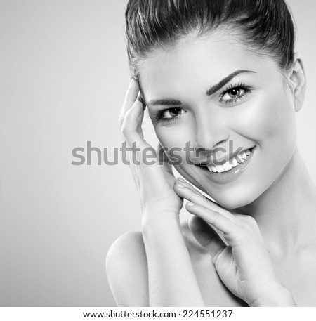 Beauty Portrait. Beautiful Spa Girl Touching her Face. Perfect Fresh Skin. Pure Beauty Model Girl. Youth and Skin Care Concept. Beauty Teenage Model Girl Portrait black and white