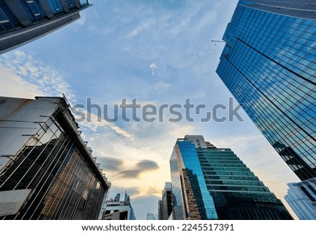 Horizontal banner of large city buildings with sky.