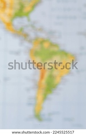 Blurred (defocused) map view of South America on a phisical map. Background for design