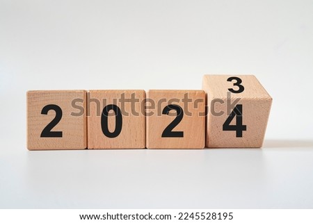 From 2023 to 2024. Merry Christmas and Happy New Year, White background.2024 new year idea concept. Royalty-Free Stock Photo #2245528195