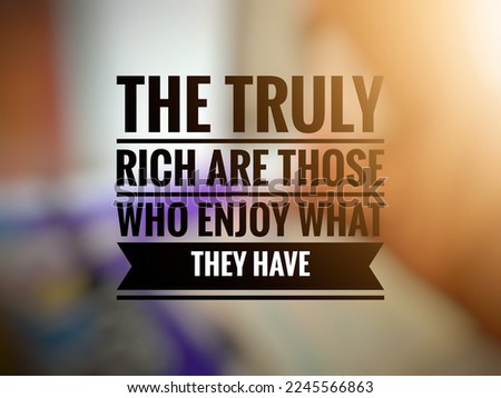 Inspirational motivation quote in bokeh background. the truly rich are those who enjoy what they have