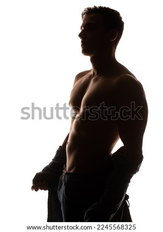 Handsome muscular man on isolated background shows his body. Sportsman body. Sport concept