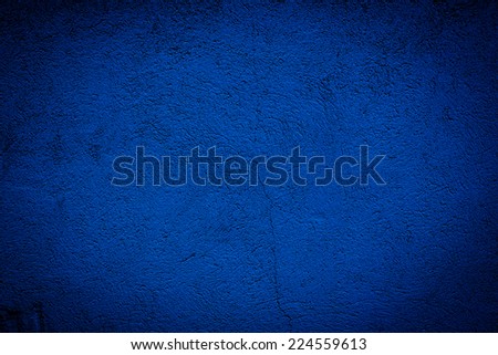 Abstract grunge dark blue texture or background with spots and scratches