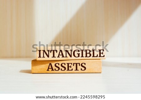 Wooden blocks with words 'Intangible Assets'. Business concept Royalty-Free Stock Photo #2245598295