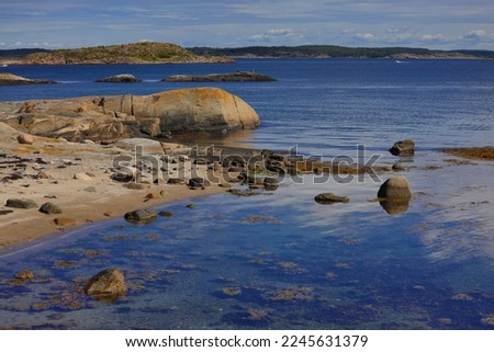 Hot summer day near the water in Sydkoster Royalty-Free Stock Photo #2245631379