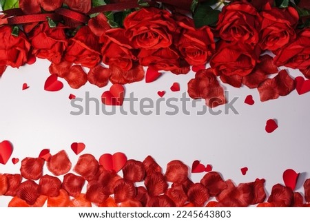 Red roses and heart shaped ornaments on white background for valentine's day Royalty-Free Stock Photo #2245643803