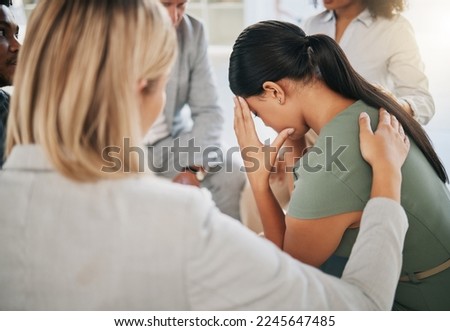 Grief, loss and woman at community support group for mental health, counseling or help. Solidarity, trust and group of people in circle comforting, helping and supporting lady with bad news together. Royalty-Free Stock Photo #2245647485