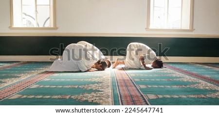 Muslim, prayer and mosque with a spiritual man group praying together during fajr, dhuhr or asr, otherwise maghrib or ishaa. Salah, worship and pray with islamic friends observing ramadan tradition Royalty-Free Stock Photo #2245647741