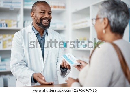 Healthcare, pharmacist and woman at counter with medicine or prescription drugs in hands at drug store. Health, wellness and medical insurance, man and customer at pharmacy for advice and pills. Royalty-Free Stock Photo #2245647915