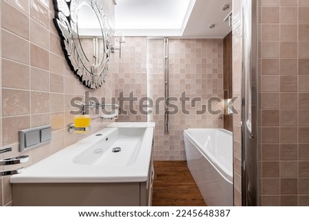 Photo of a bathroom in pastel colors with the lights on