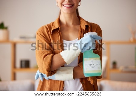 Spring cleaning, hands and bottle with chemical spray, eco friendly products and disinfection of bacteria, dirt and household maintenance. Closeup cleaner, cleaning service and liquid detergent soap Royalty-Free Stock Photo #2245655823