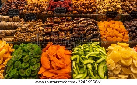 a dried fruit stall at the egyptian market in istanbul.very colourful picture with green orange yellow brown fruits