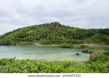 Calm cove and natural landscape of the Imgya Marine Garden in Miyakojima Royalty-Free Stock Photo #2245657531