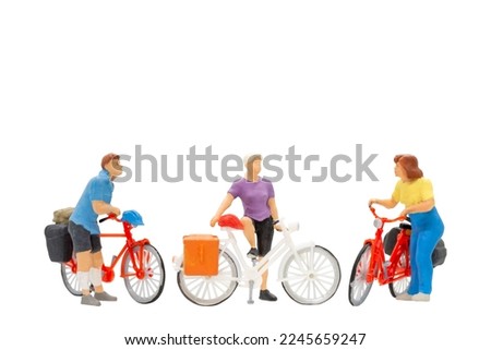 Miniature people , Cyclist with a saddle bag isolated on white background with clipping path Royalty-Free Stock Photo #2245659247