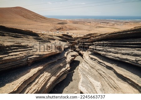 Unusual canyon like rock formations Las Grietas "The cracks" of Montana Blanca Royalty-Free Stock Photo #2245663737