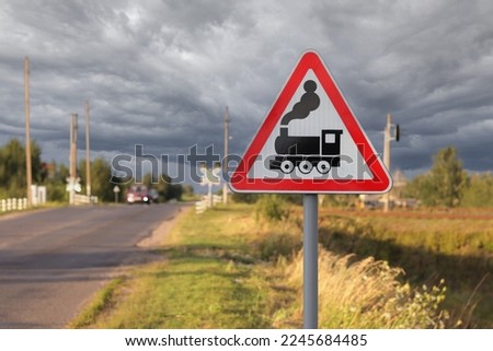 Road sign - danger, train. Road sign in front of a railway crossing