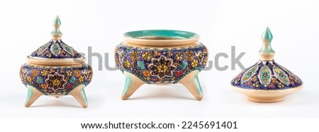 A clay dish with traditional oriental motifs. Traditional Slimi motifs on a clay dish. Royalty-Free Stock Photo #2245691401