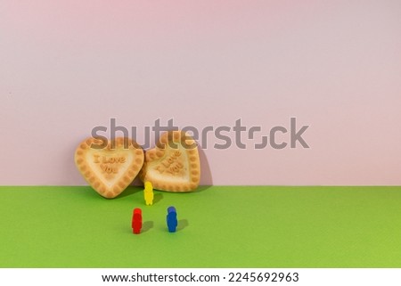 Valentine's day concept. Heart and three men on a bright background. Love triangle.
