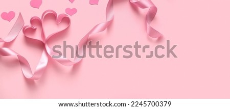 Hearts made of ribbon on pink background with space for text. Valentine's Day celebration