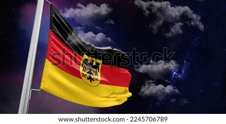 Germany national flag cloth fabric waving on beautiful Blue Background.