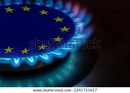 europe flag and hob burner of blue gas, cost of gas, the euro crisis, sancions on russian gas, hob with blue gas flame and euro sign