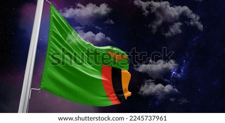 Zambia national flag cloth fabric waving on beautiful Blue Background.