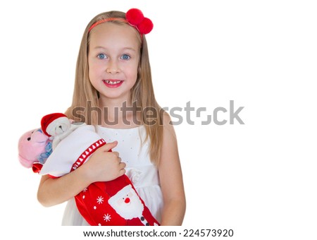 Happy little girl with Christmas presents