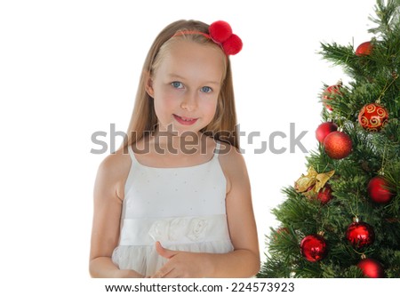 Happy little girl with Christmas tree