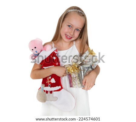 Happy little girl with Christmas presents