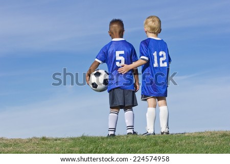 Youth Soccer Players standing together Rear View