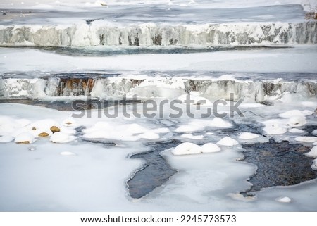 Frozen Elbe River in Spindleruv Mlyn in winter. Mountain town near Hradec Kralove, Czech republic. High quality photo