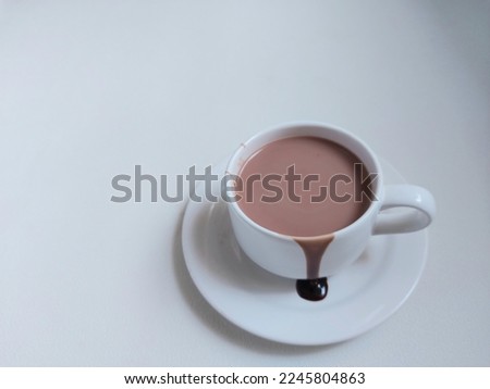 A cup of hot chocolate. Sweet taste. Isolated background in white. 