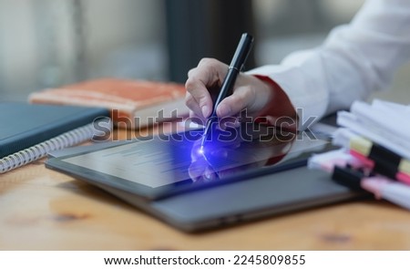Business woman hand working on tablet with finance marketing chart, Business digital technology and marketing concept, 