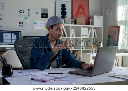 Asian man Graphic designer working in office. Artist Creative Designer Illustrator Graphic Skill Concept.