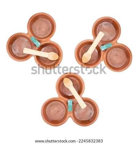three Tableware with divisions of red clay made in Mexico. Traditional handmade Mexican clay crockery. isolated White background.
