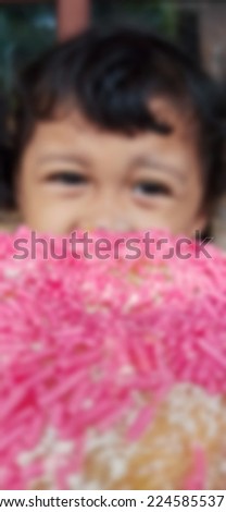 Blur photo of little girl with pink donut