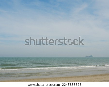 The beach with blue sky in background, Wave in the sea were hitting the shore, Thailand