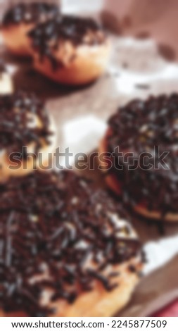 Blur photo of donut with sweet chocolate mises that looks delicious
