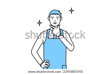 A man in an apron in a confident pose.