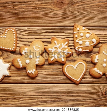 homemade christmas gingerbread cookies on wooden background
