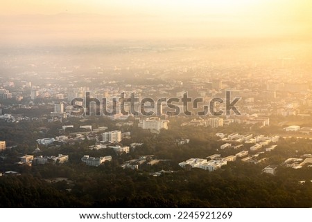 Aerial view of Chiangmai with PM 2.5 pollution covering the city in morning. Royalty-Free Stock Photo #2245921269