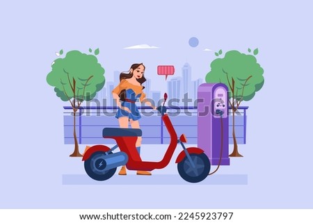 Woman charges the electric bike at Electronic Vehicle center