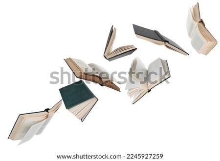 Many hardcover books flying on white background Royalty-Free Stock Photo #2245927259