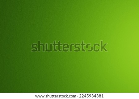 Paper texture, abstract background. The name of the color is alien green. Gradient with light coming from right
