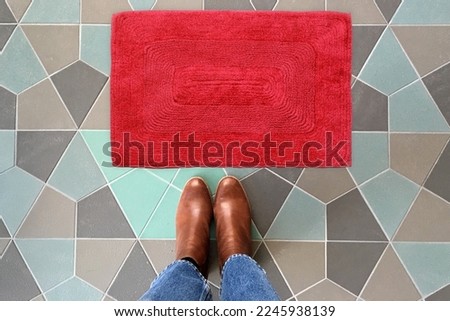 Designer Welcome Entry Doormat Placed on Colorful Tiles Floor with Brown Shoes