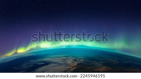 Northern lights aurora borealis over the planet Earth "Elements of this image furnished by NASA" Royalty-Free Stock Photo #2245946195