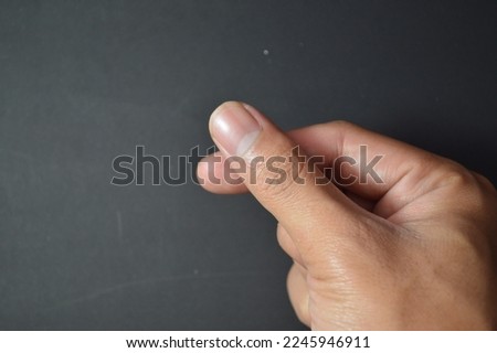 Finger symbol over black background. Used for background