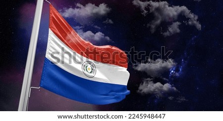Paraguay national flag cloth fabric waving on beautiful Blue Background.