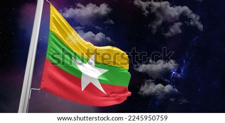 Myanmar (Burma) national flag cloth fabric waving on beautiful Blue Background.